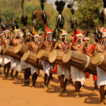 Tribal community celebrating a festival in Odisha with traditional dance and music