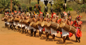 Tribal community celebrating a festival in Odisha with traditional dance and music